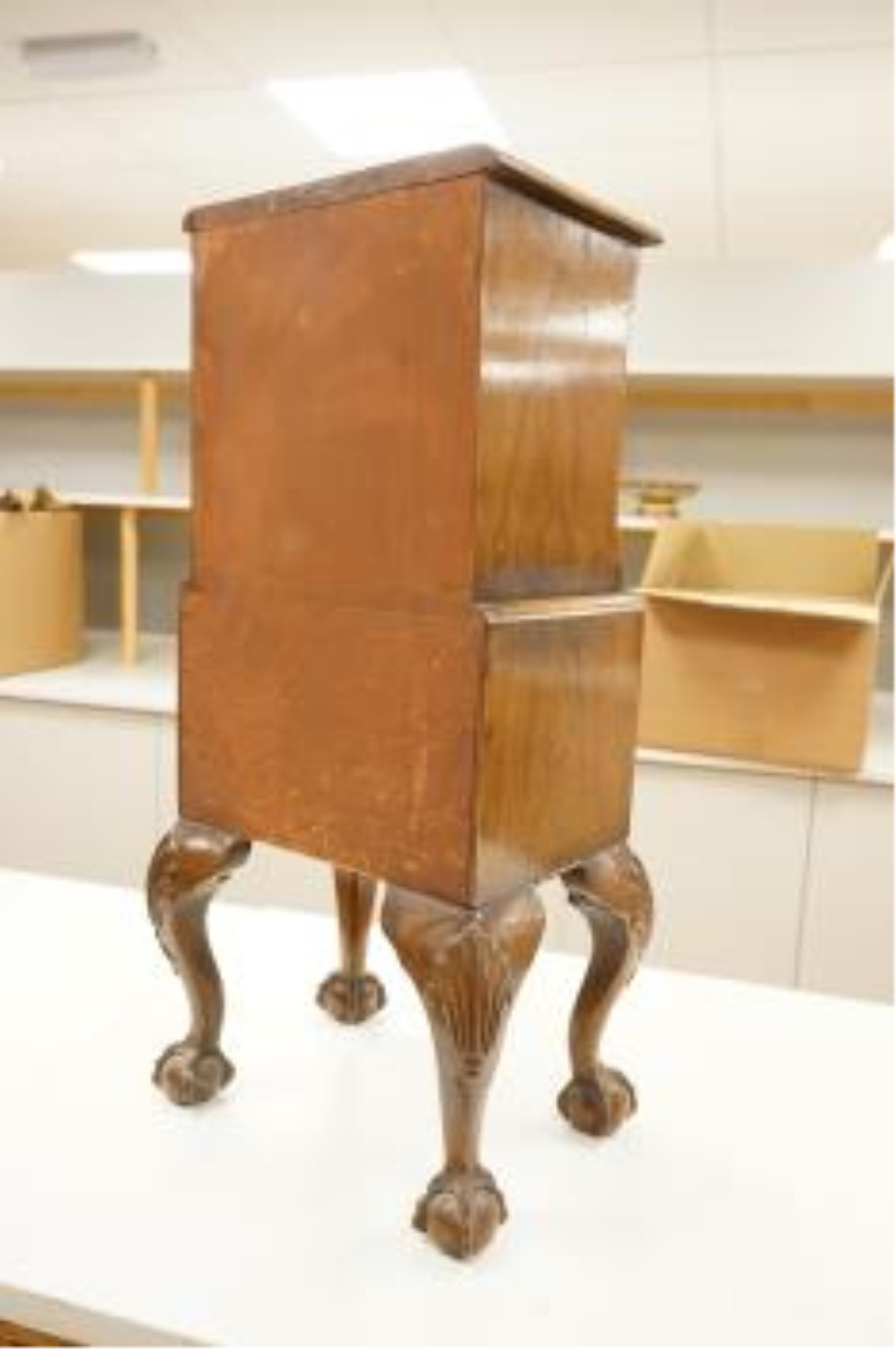 An early 20th century miniature walnut four drawer chest, 67cm